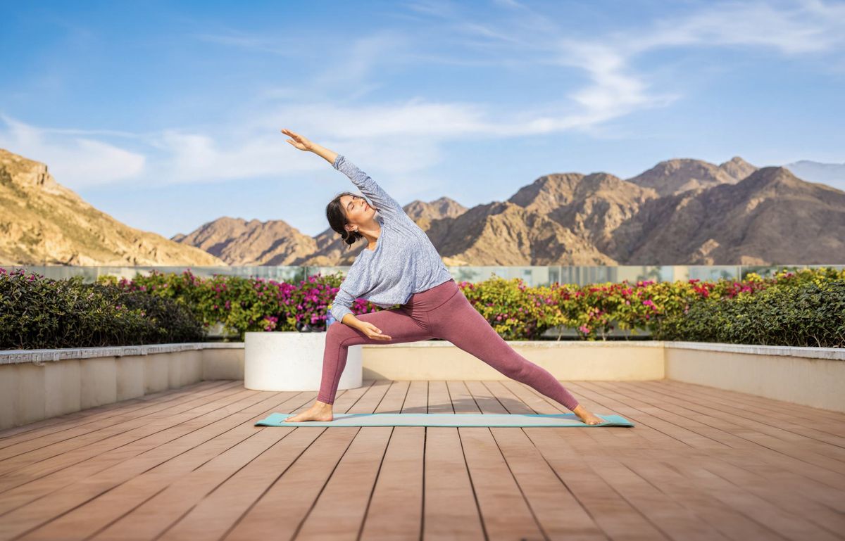 Rooftop yoga at sunrise